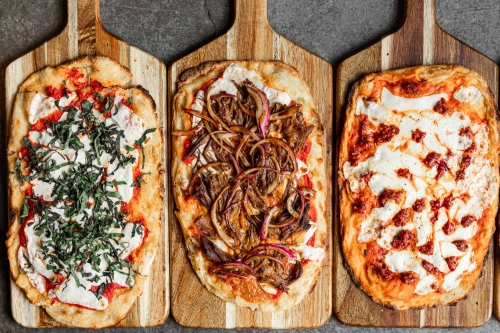 Margarita, Sicilian Sausage, & Spicy Vodka Flatbreads at The Sicilian Butcher in Phoenix, AZ.