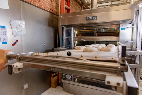 Proof Bread Putting Sourdough Loaves into the Oven