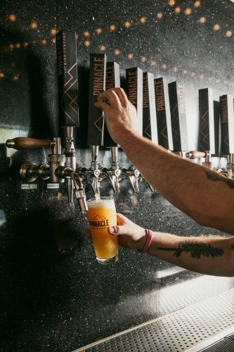 beer pouring at pinnacle brewing company