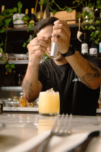 making a cocktail at mixela